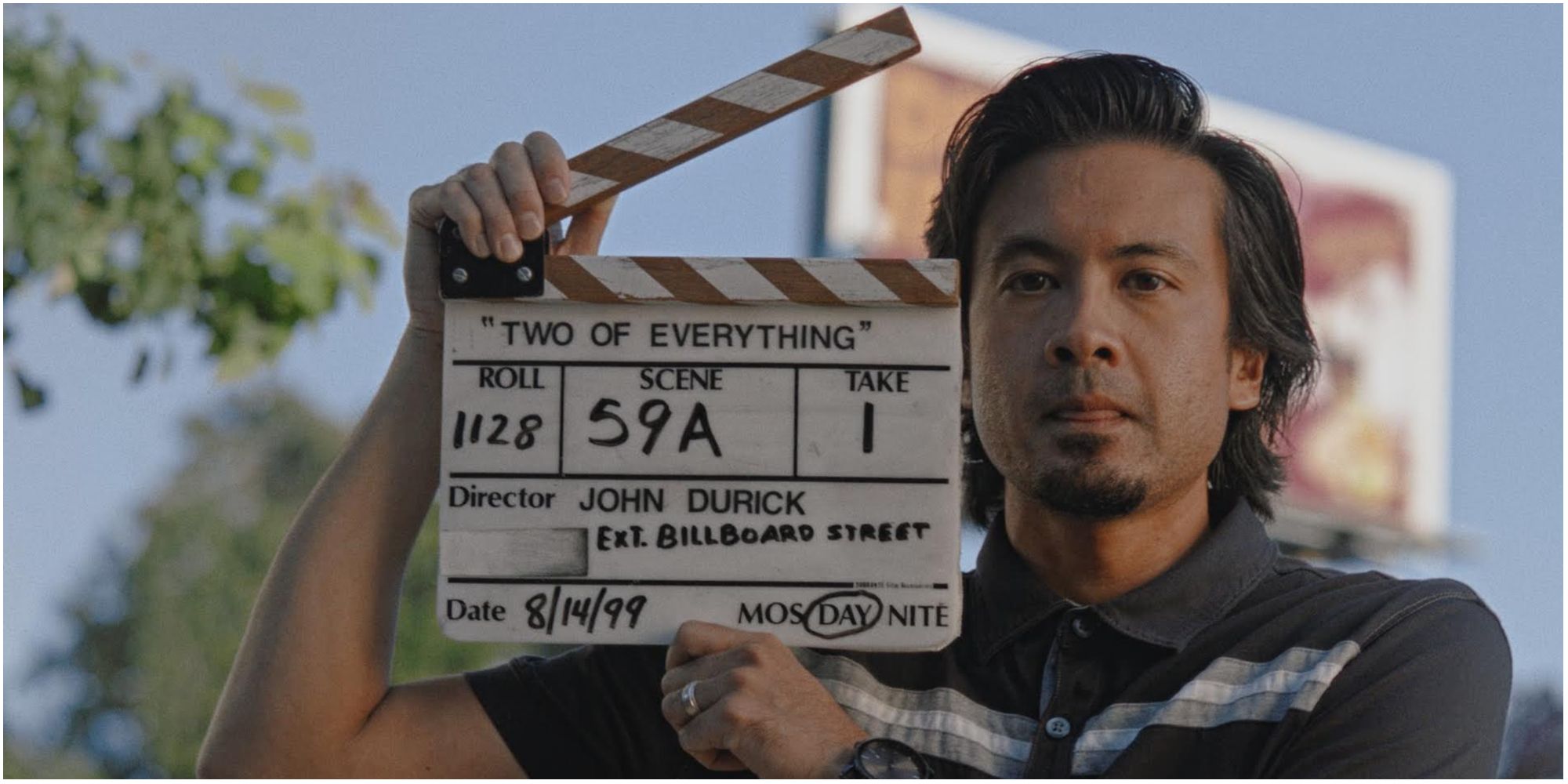 A member of crew holding a clapper board