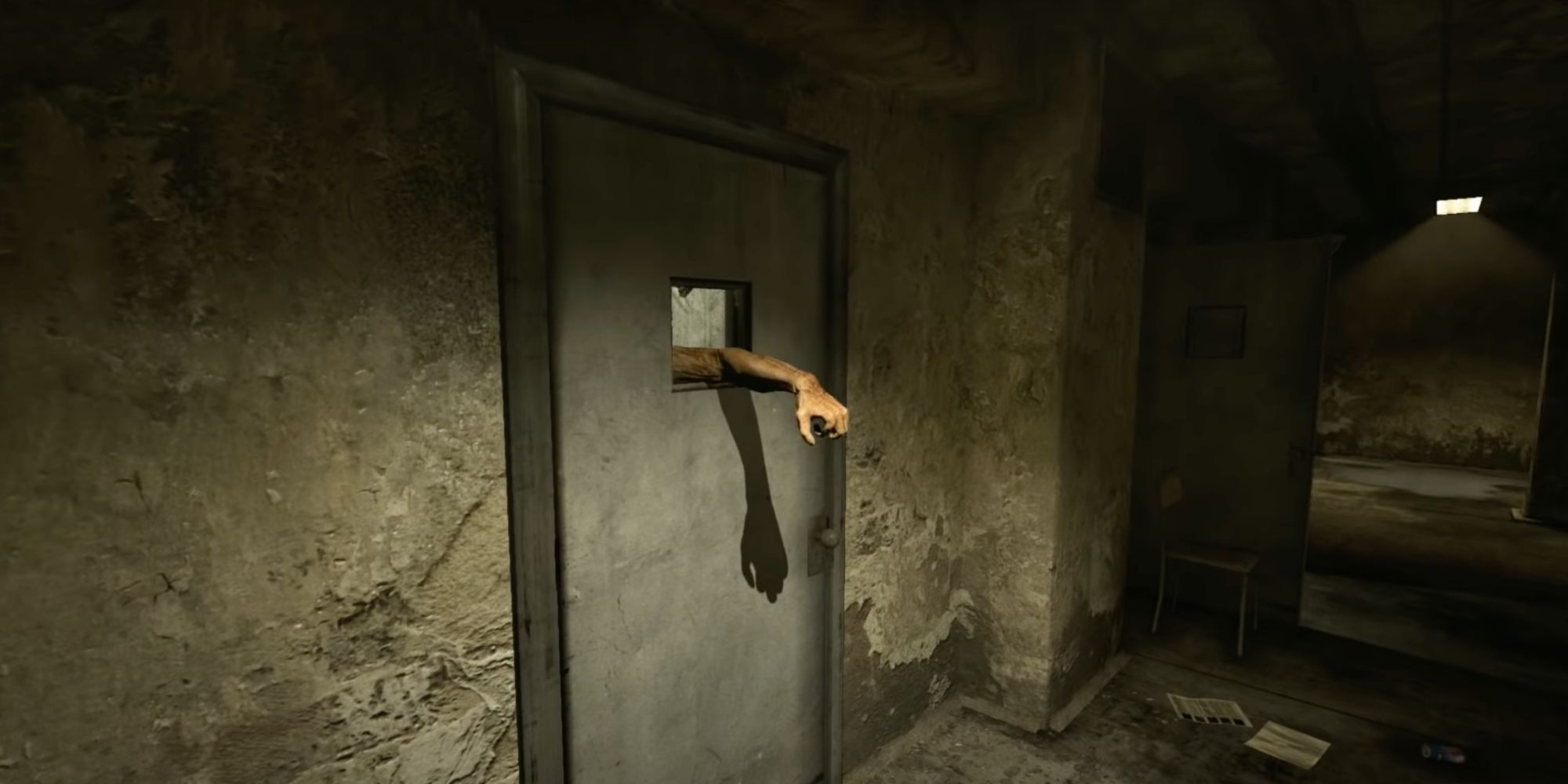 outlast prison block arm reaching out of cell