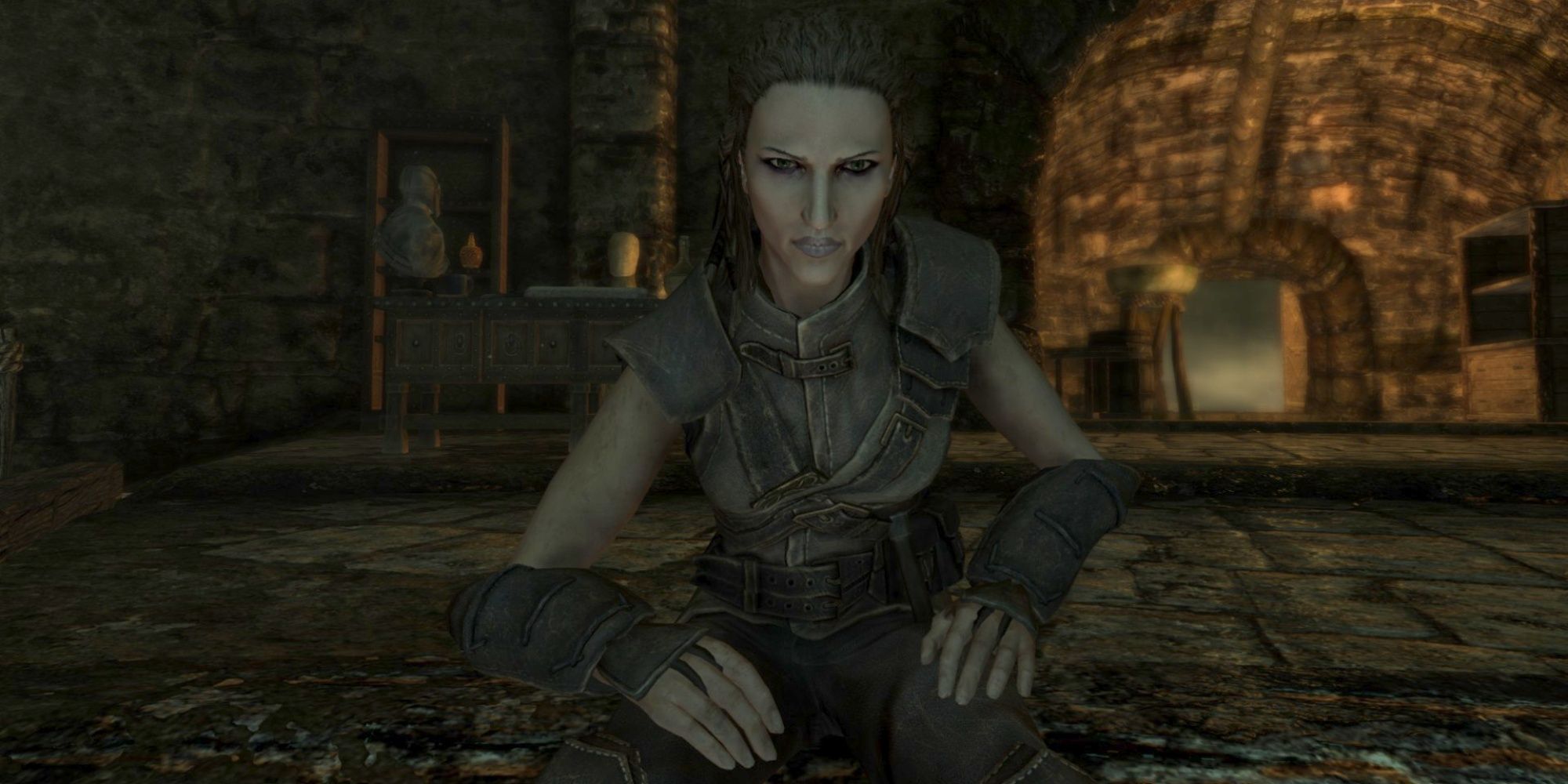 Skyrim screenshot of Sapphire sitting down facing player.