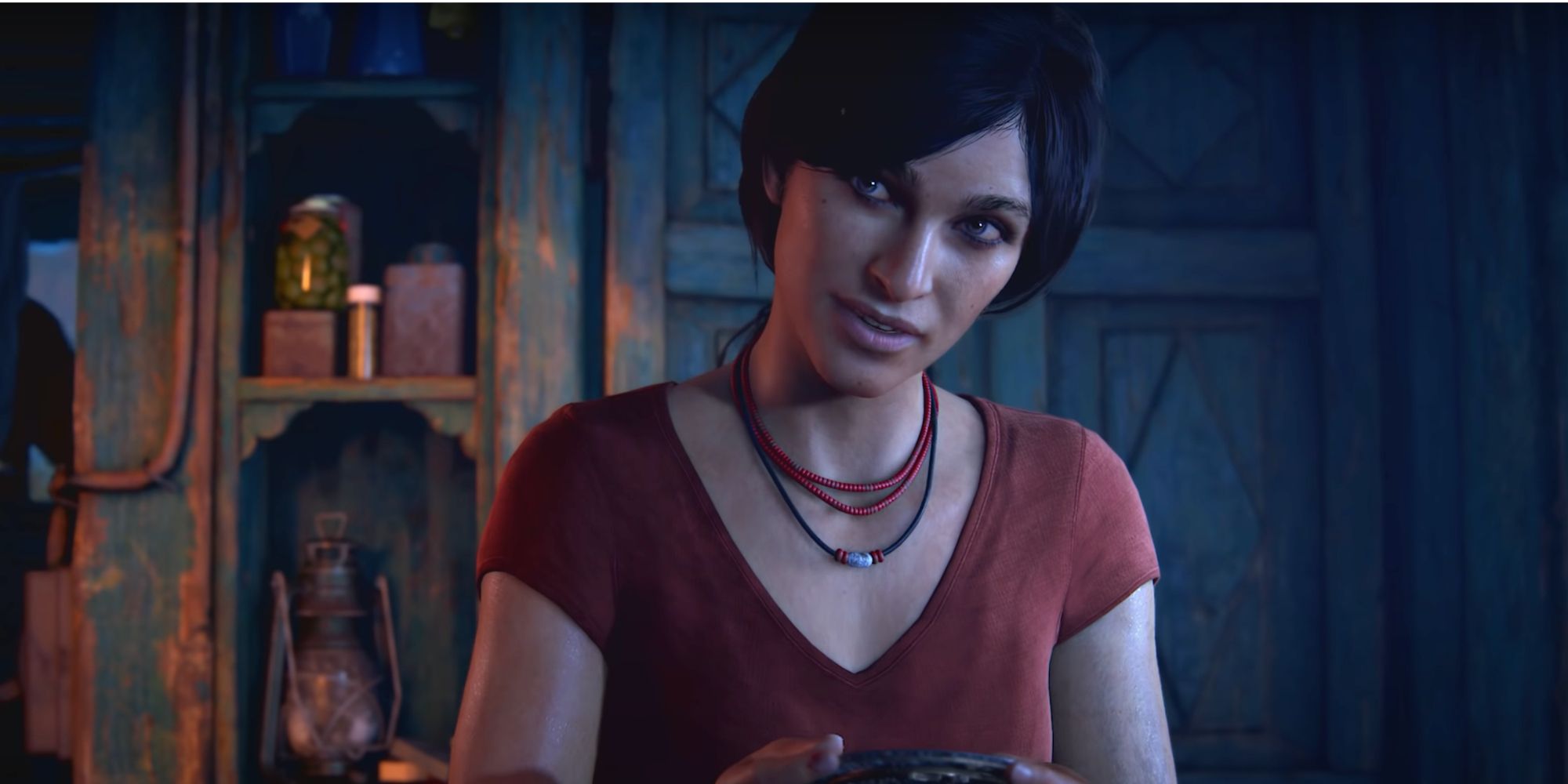 uncharted lost legacy chloe frazer holding artifact on boat