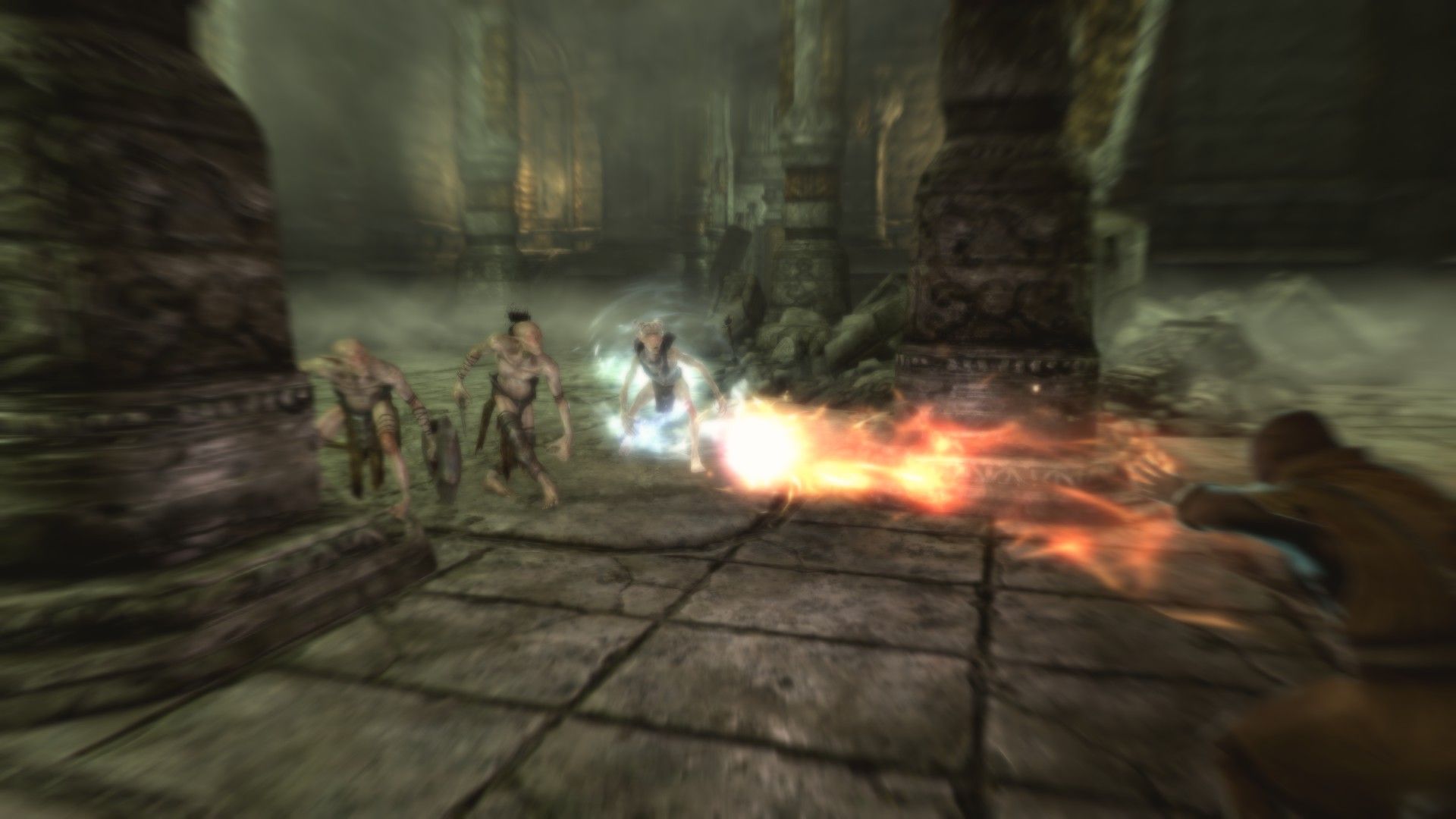 A mage flings a fireball at encroaching enemies in a stone room