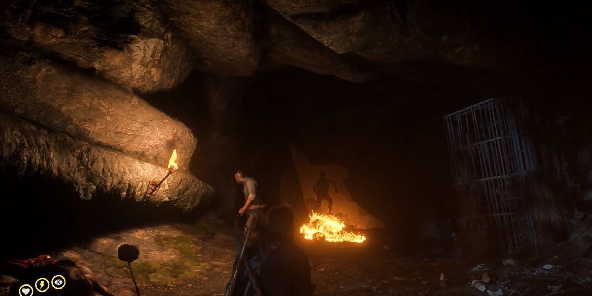 Murfrees run through fire at the mouth of a cave toward Arthur and Charles