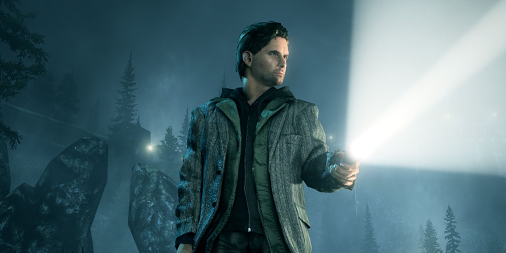 Alan Wake holding a flashlight at night. Trees line the background in fog.