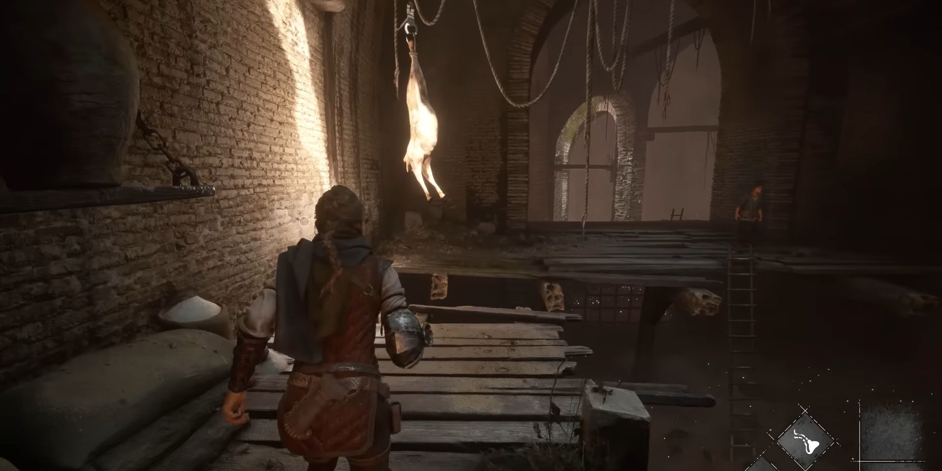 Screenshot of some rat bait suspended on the ceiling in Plague Tale: Requiem. 
