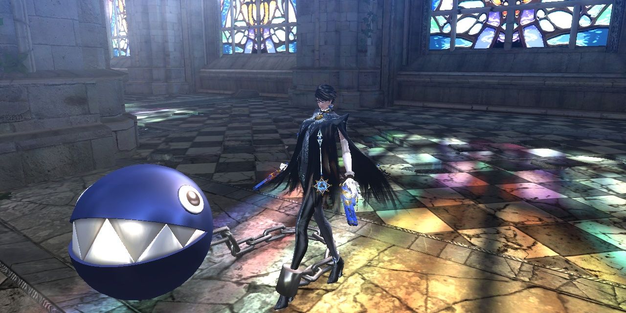 Bayonetta stood beside the Chain Chomp tied to her leg