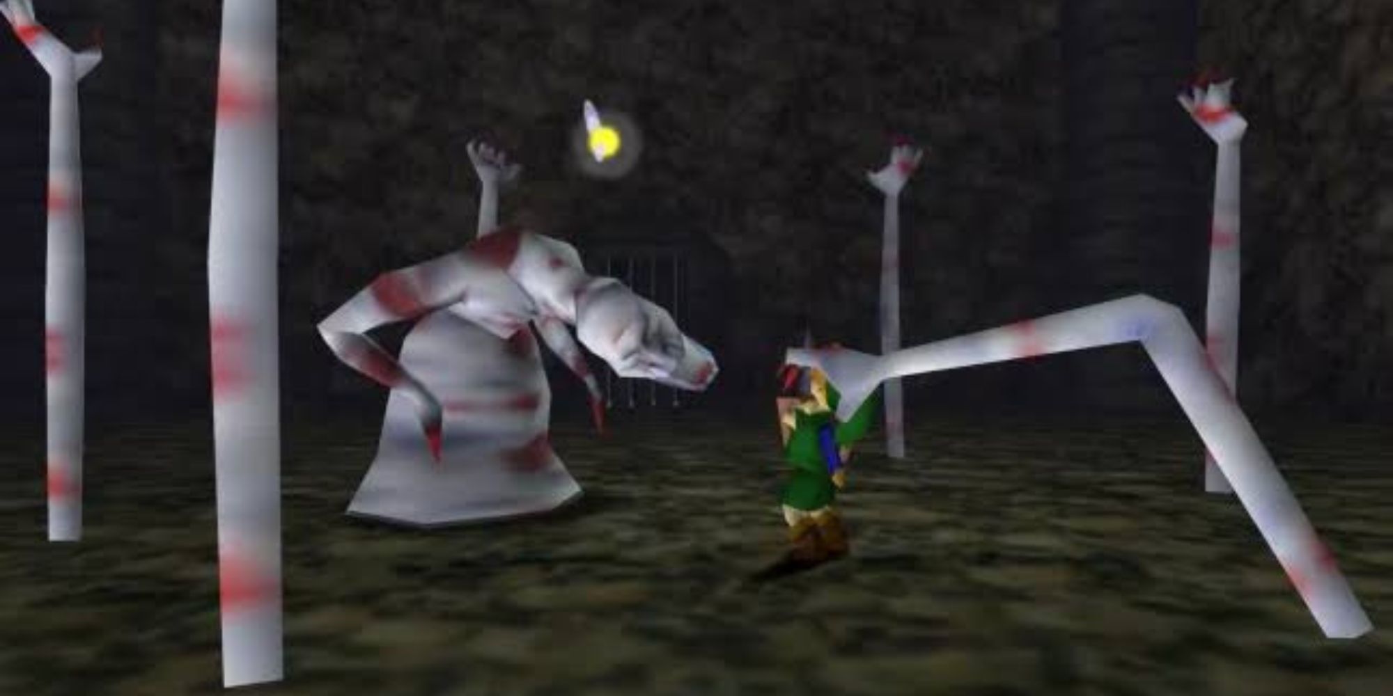 Dead Hand approaches Link as giant arms rise from the ground in The Legend Of Zelda Series.