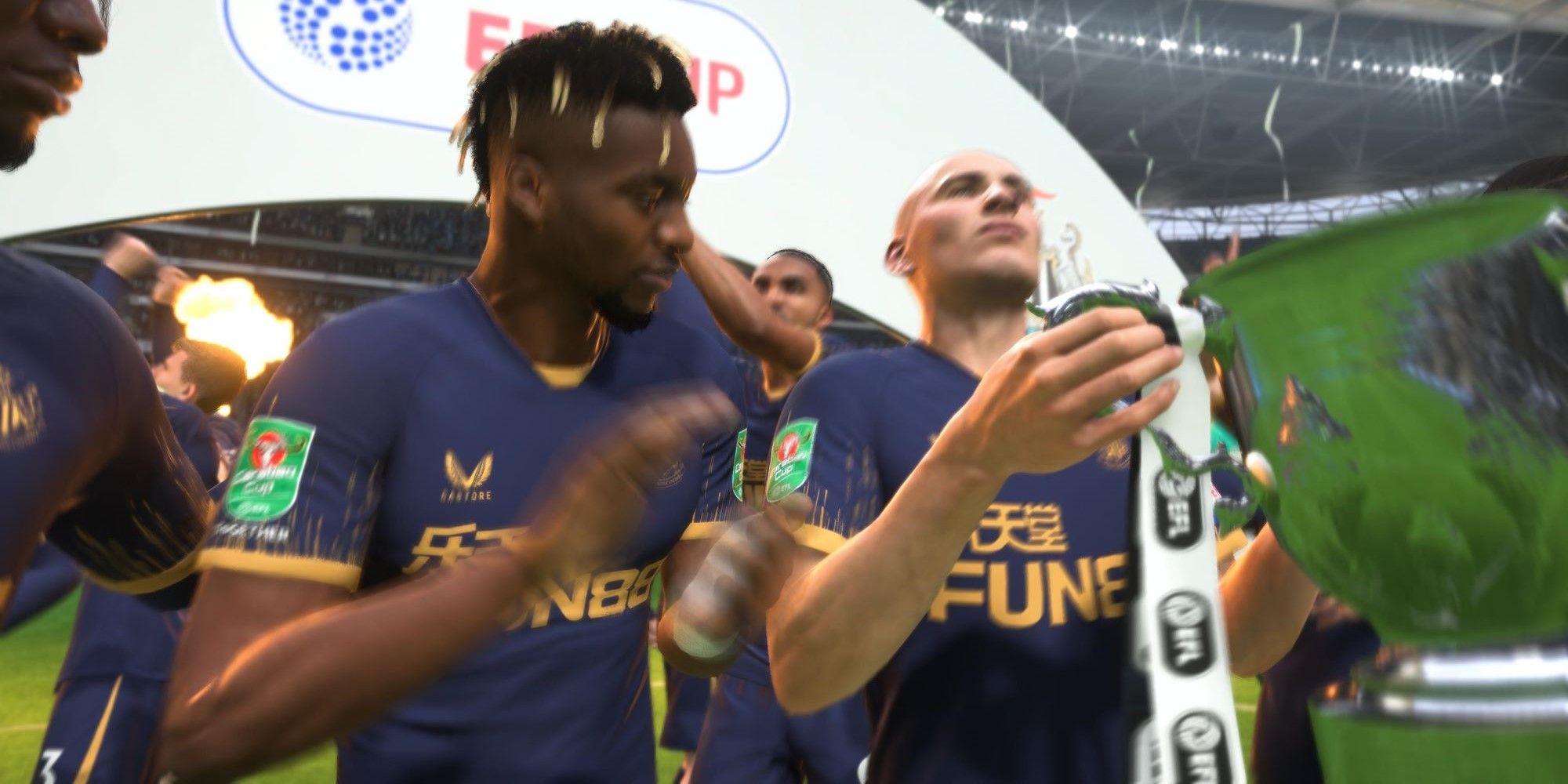 FIFA 23 Newcastle players ASM and Shelvey lifting the League Cup