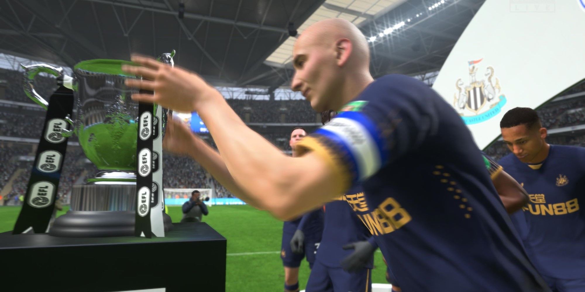 FIFA 23 Shelvey with the League Cup