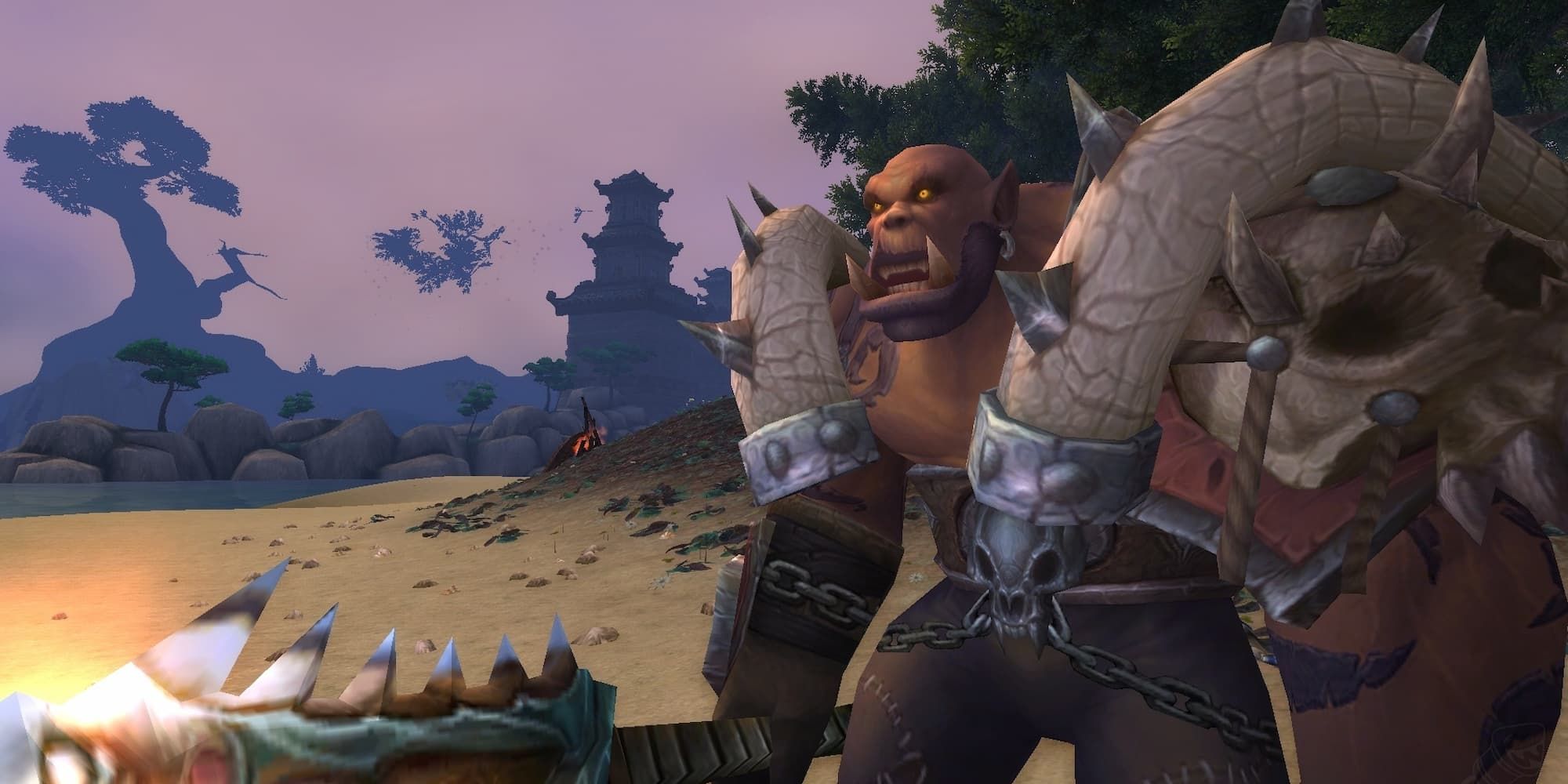 Garrosh Hellscream stands on a beach with his weapon, looking menacingly.