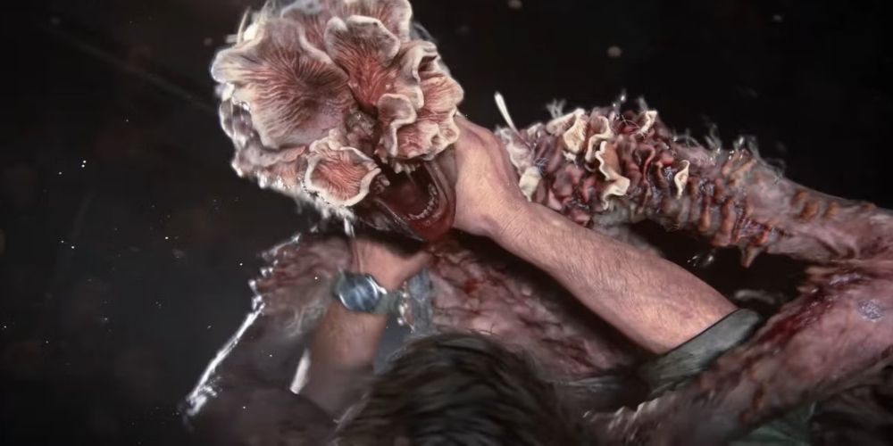 Joel with his hands on a Clicker's throat under the Clicker in The Last Of Us