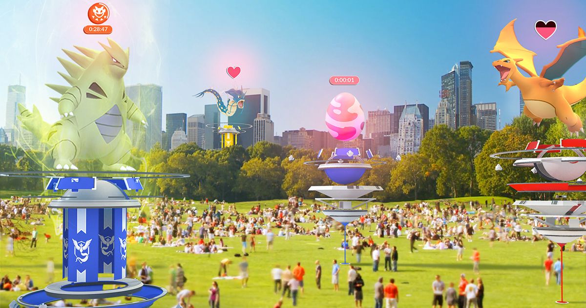 A park with several Pokemon Go Raids, filled with people