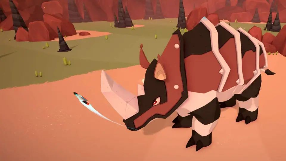 Rhoulder standing in an open, dry field.