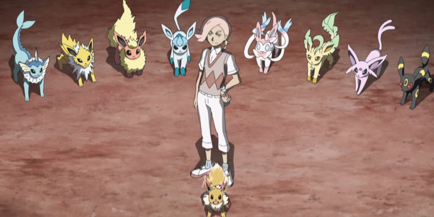 Ilima standing with Eevee and all of its evolutions 