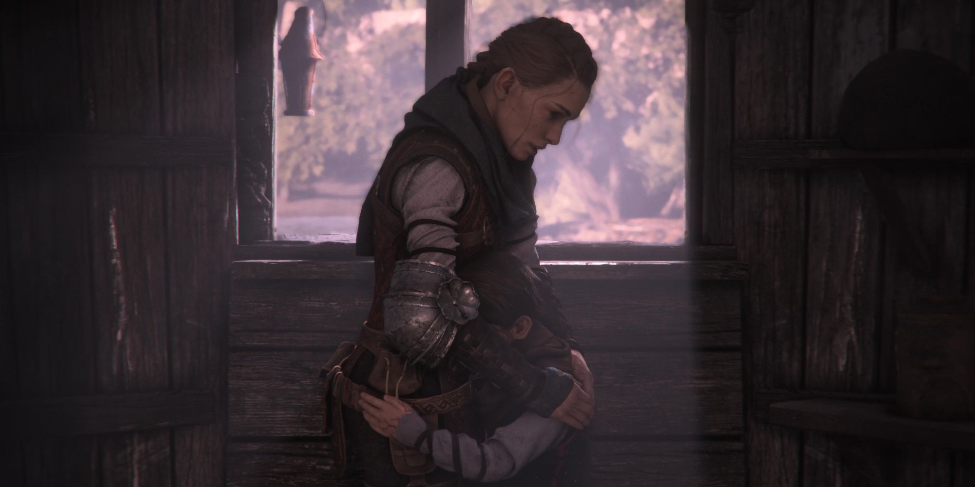 Amicia and her brother Hugo sharing a warm embrace in A Plague Tale Requiem.