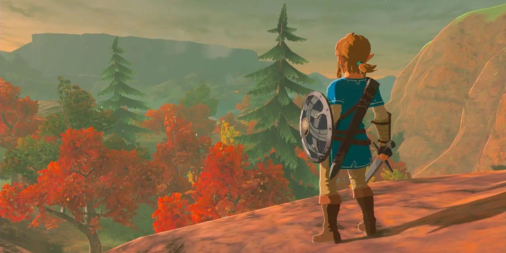 Legend of Zelda: Breath of the Wild - Link looks out at scenery full of autumn colours