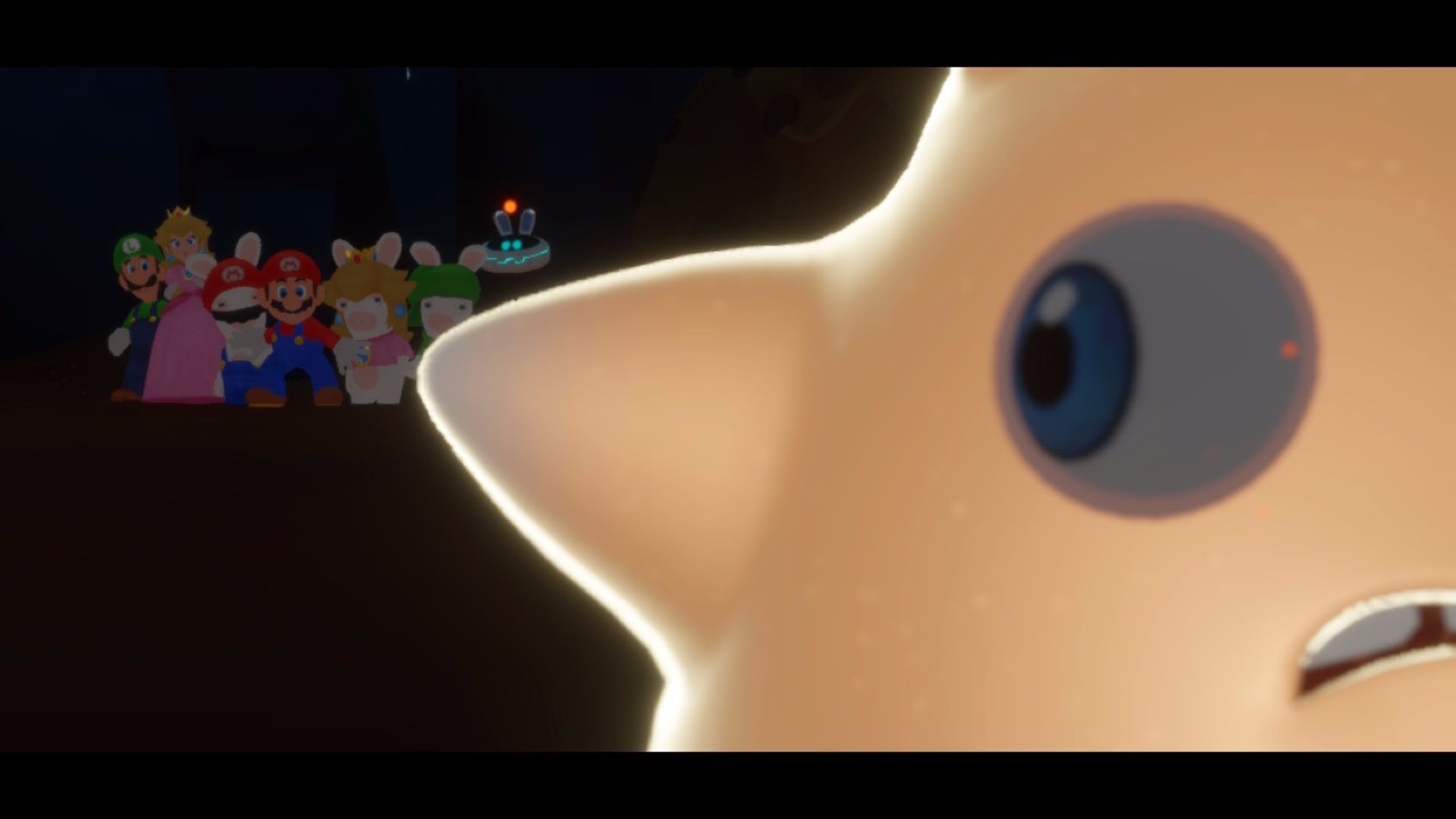 The Spark looks over his shoulder at the heroes in Mario + rabbids sparks of hope
