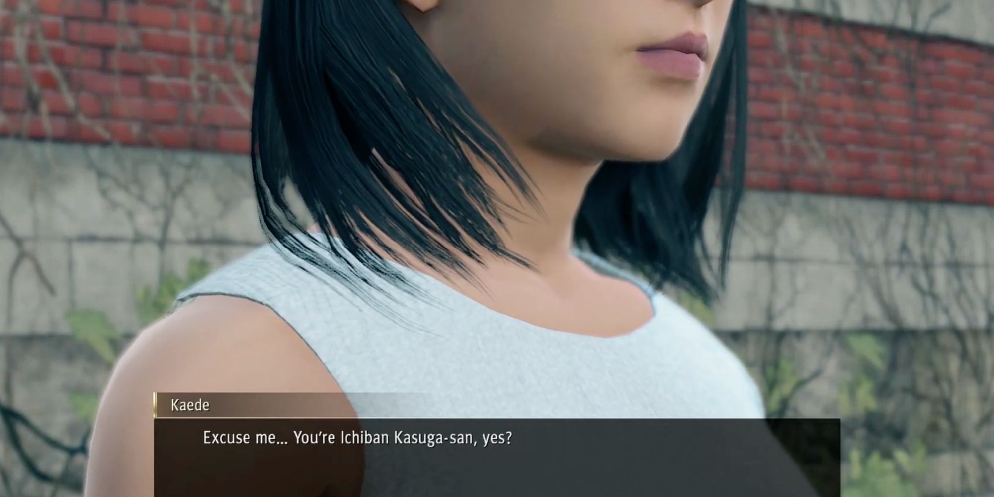 A screenshot from Yakuza: Like A Dragon, showing Kaede stopping Ichiban on the street
