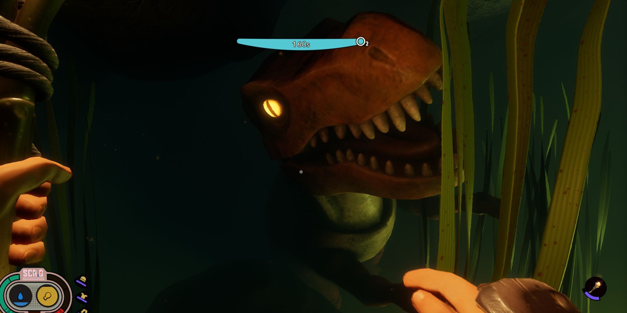A submerged toy T-Rex with open mouth and glowing eyes is stuck at the bottom of a pond surrounded by darkness and grass