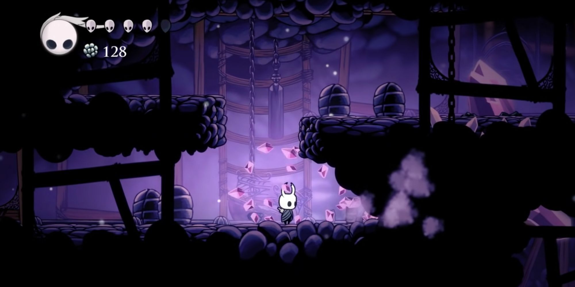 Hollow Knight character standing in cave