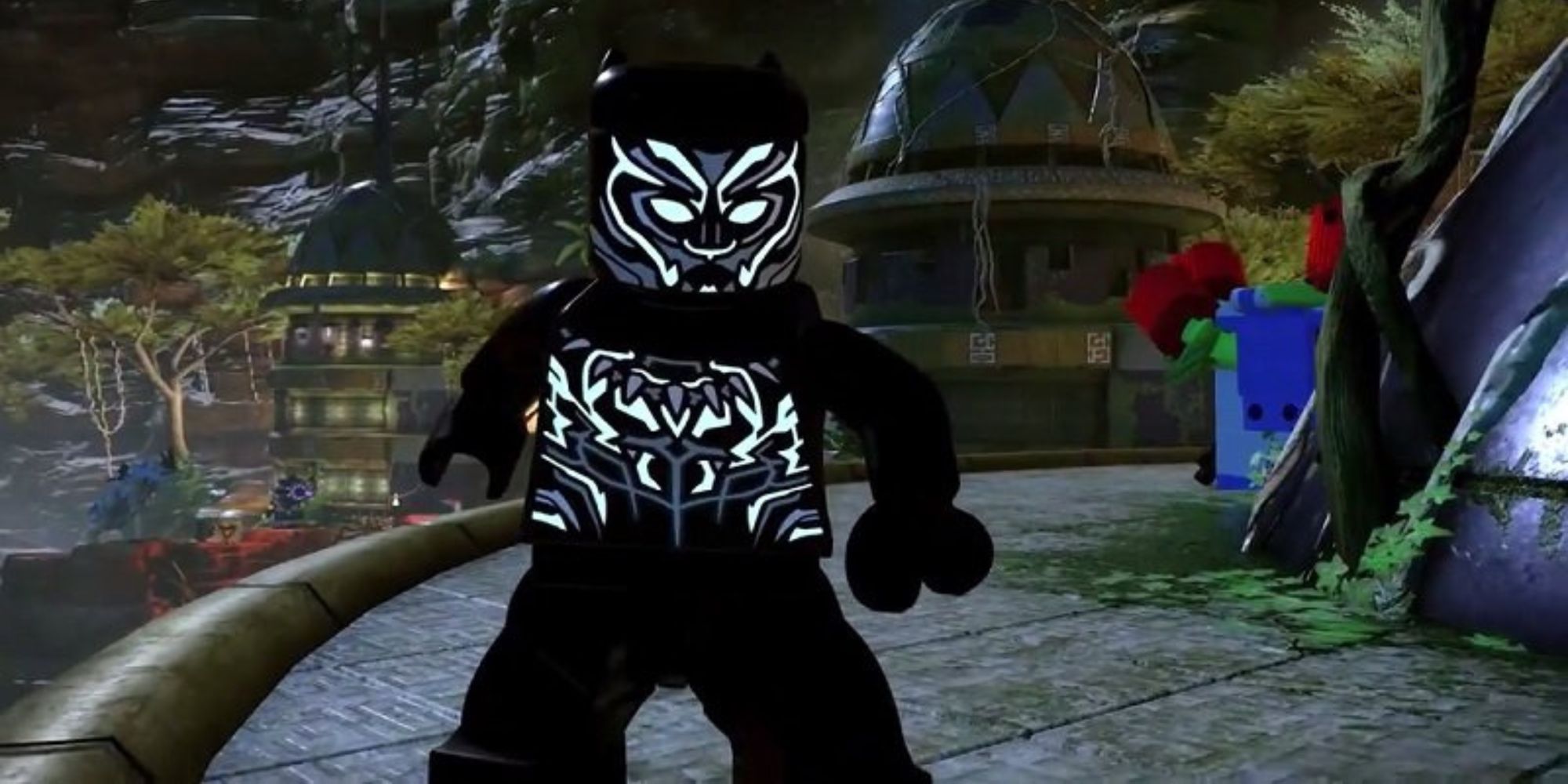 Lego Black Panther stands outside a building at night