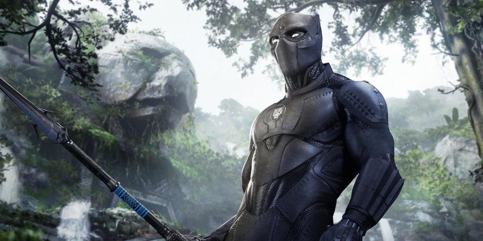 Black Panther holds a spear in a jungle surrounded by waterfalls