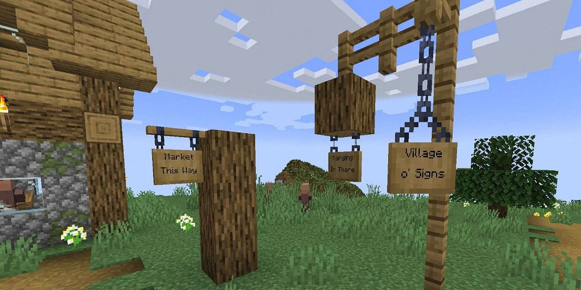 A few hanging signs are situated outside a village
