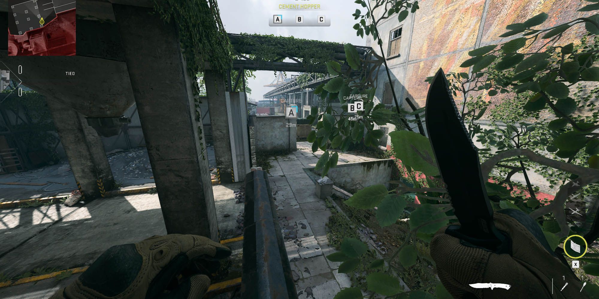 Modern Warfare 2 crouching near foliage at the top of a wall