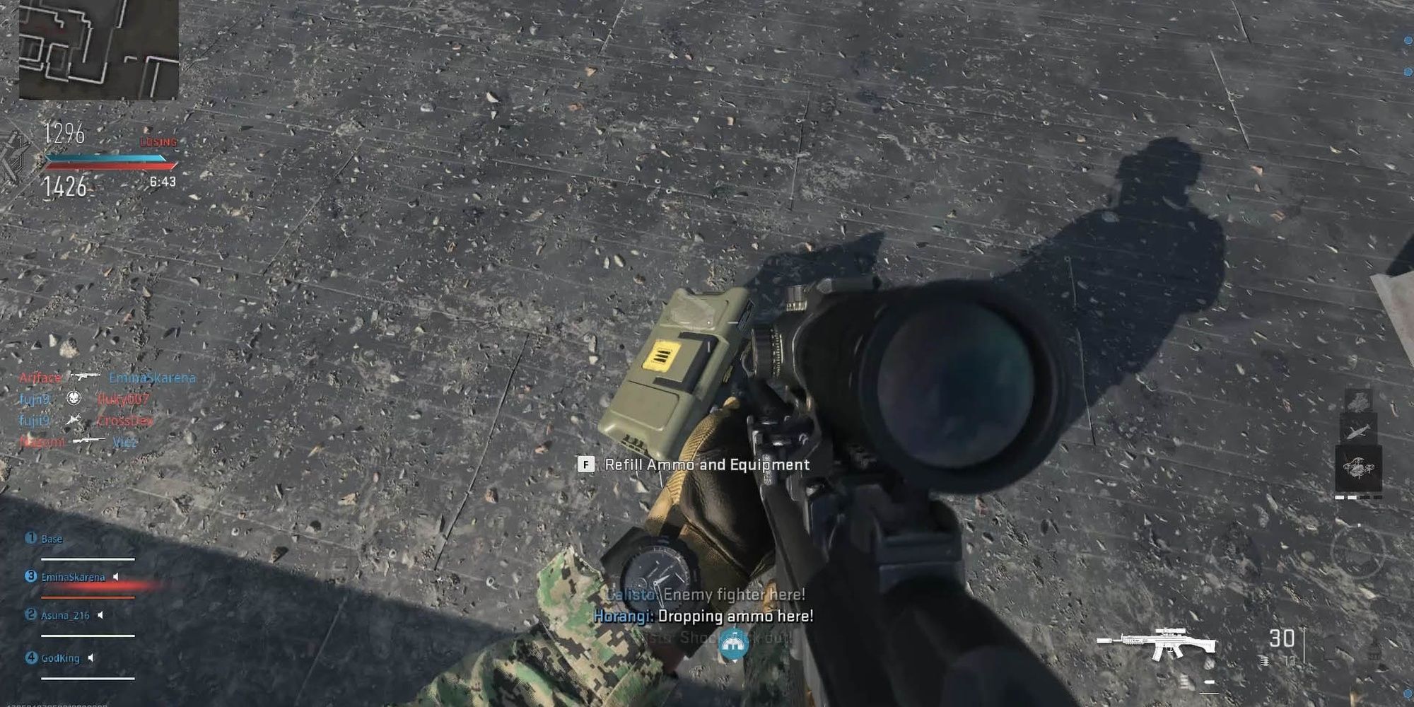 Modern Warfare 2 holding a sniper and interacting with munitions box