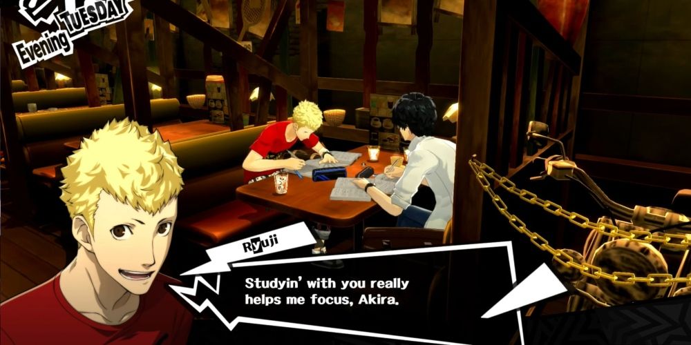 Ryuji and Joker studying in the diner in Persona 5 Royal