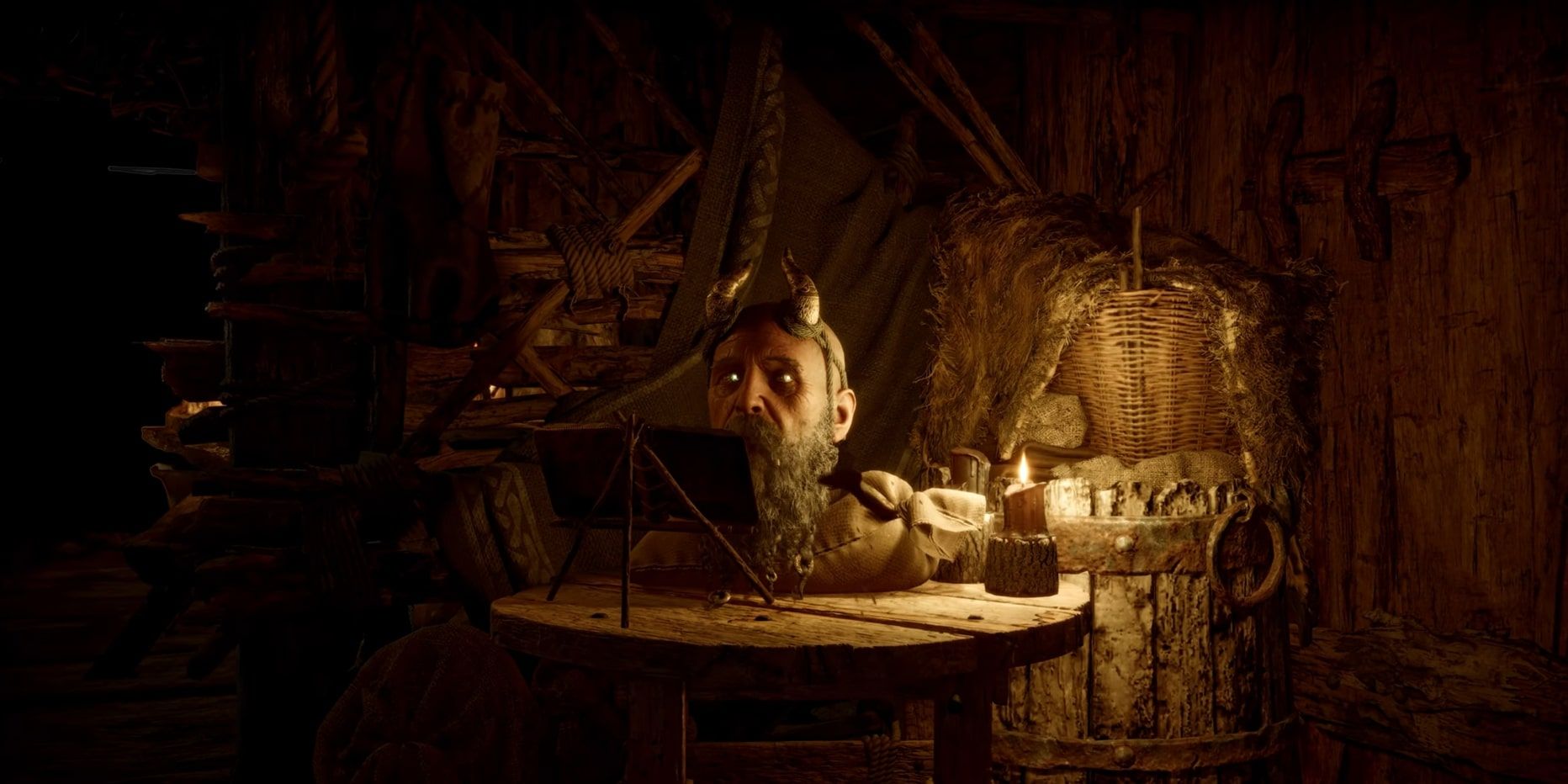 Screenshot of Mimir in his usual spot reading a book in God of War Ragnarok.