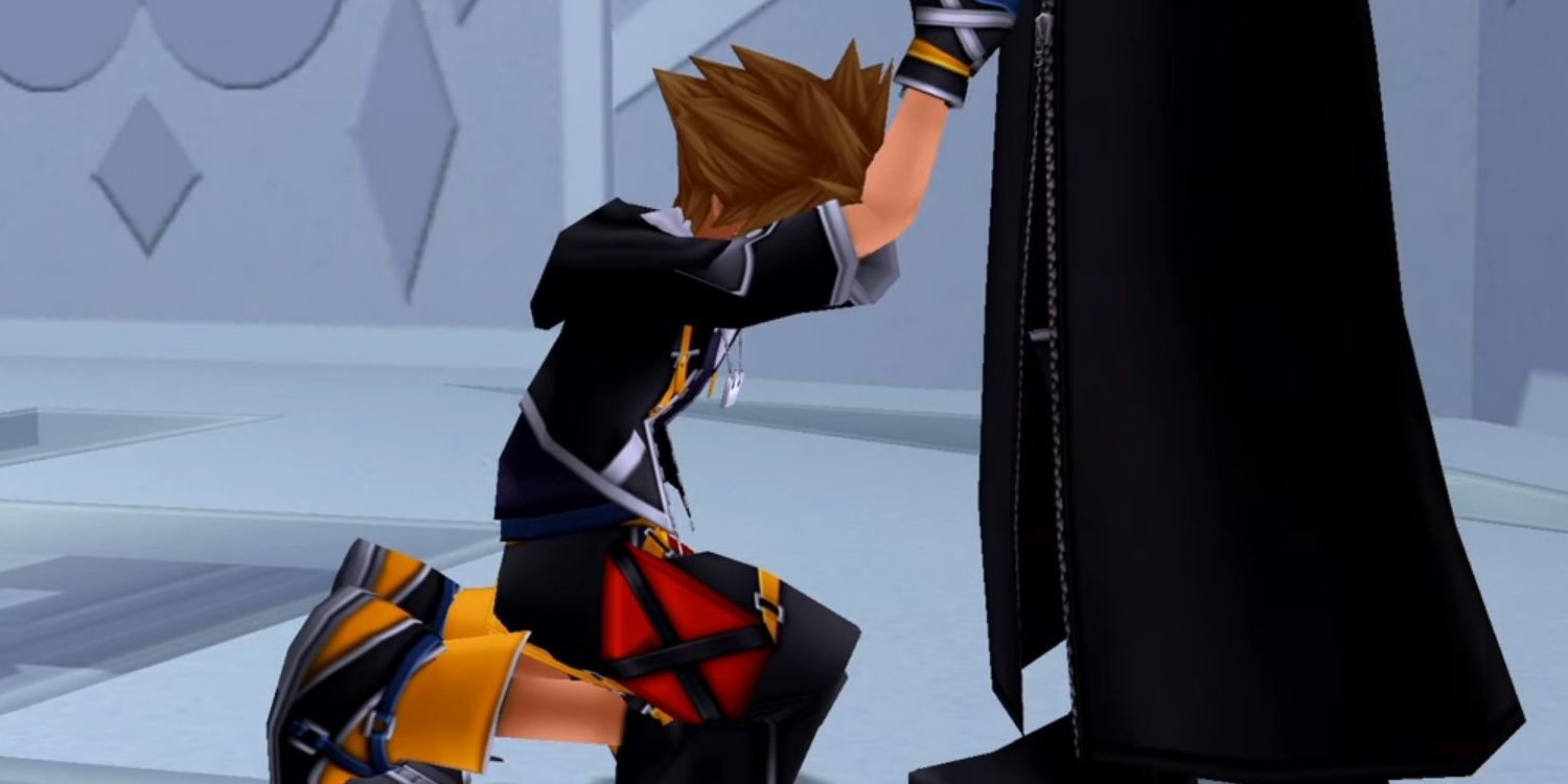 Sora on his knees in front of Riku, holding his hand.