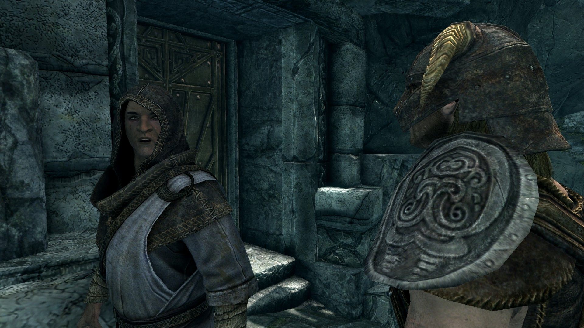 A robed warrior monk speaks to an adventurer outside a door to a house inside a stone city. 