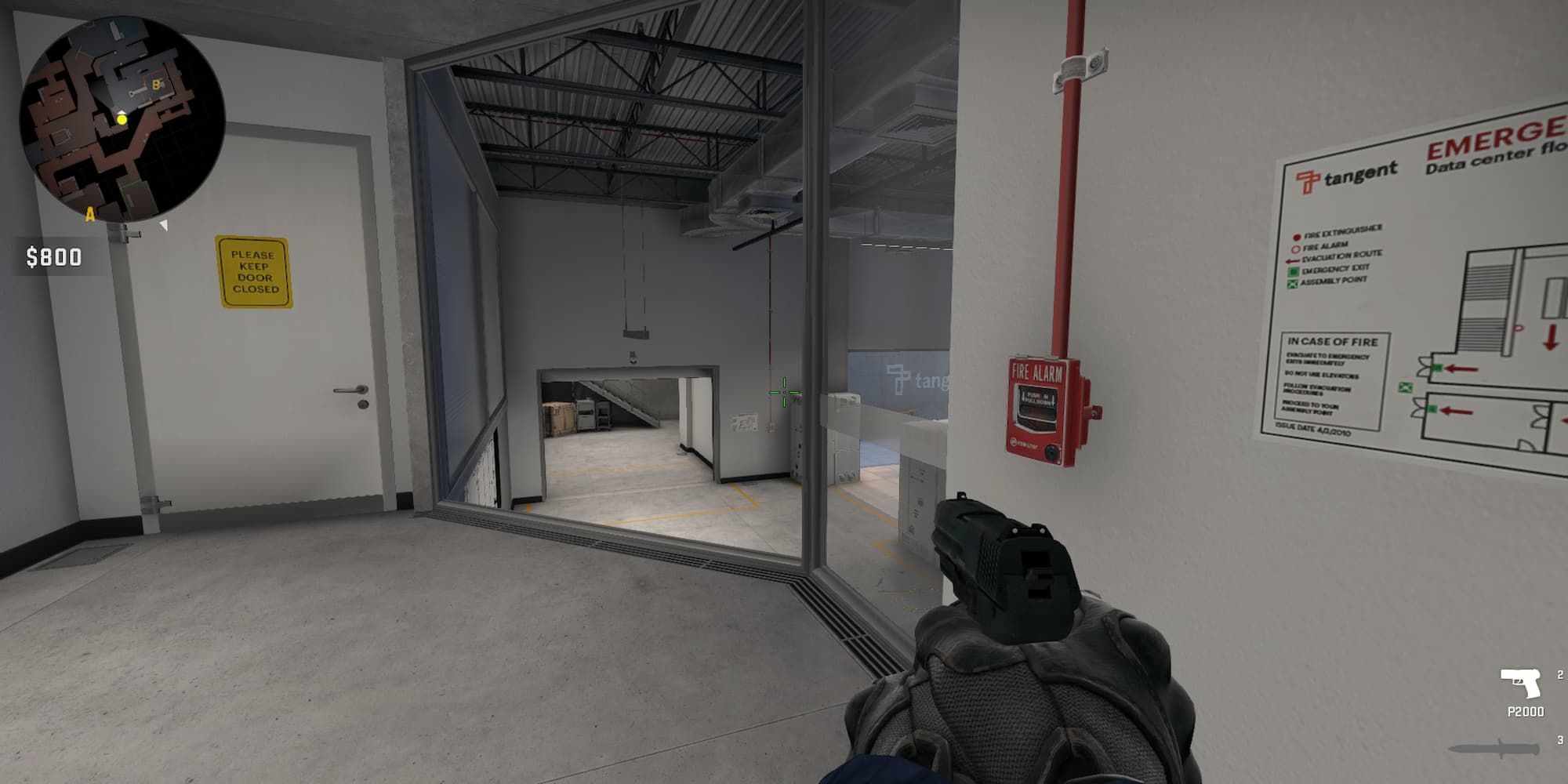 The player looks through the broken glass window at Security Doors on Breach.