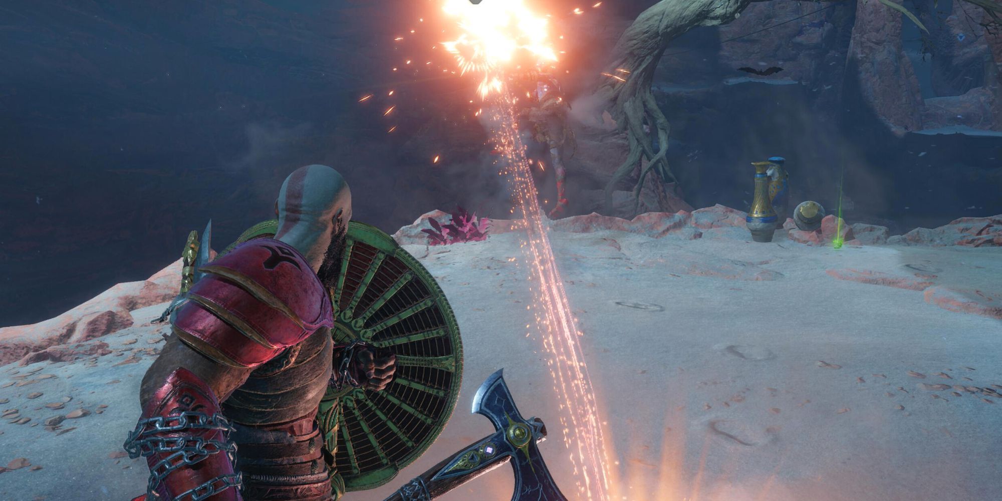 Kratos blocking an attack with a circular shield. His axe is equipped in his right hand.