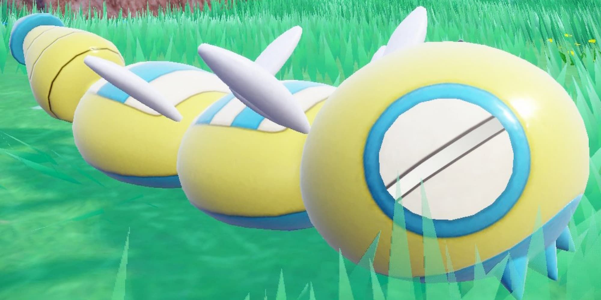 A Two-Segment Form Dudunsparce slides across the grass in Pokemon Scarlet & Violet.