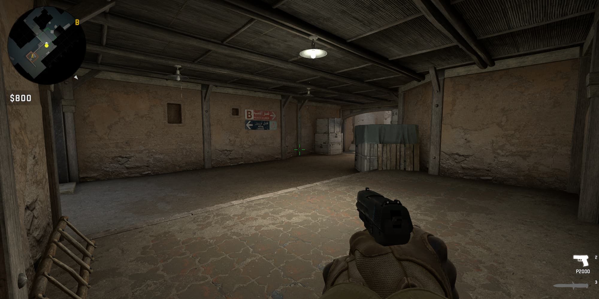 A player backs into the corner of CT Start on Dust 2.