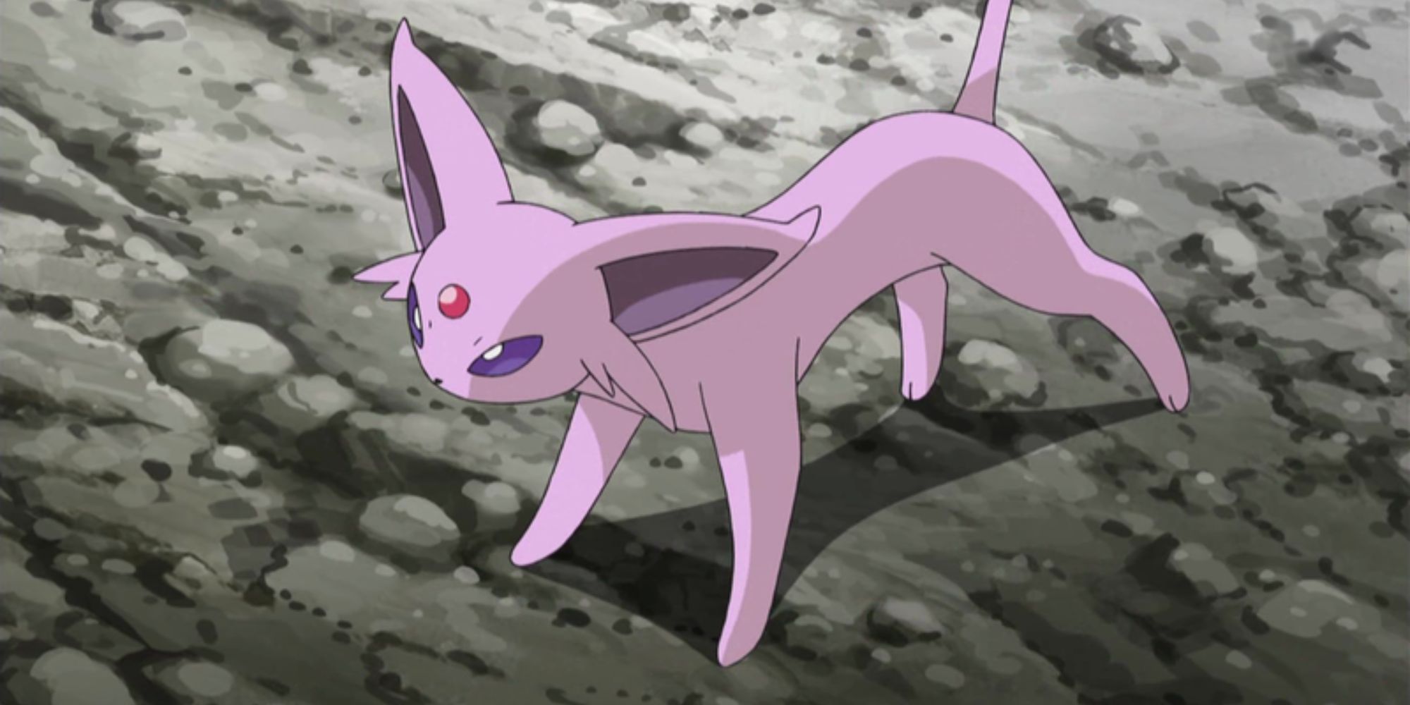 Espeon stands on a dirt path