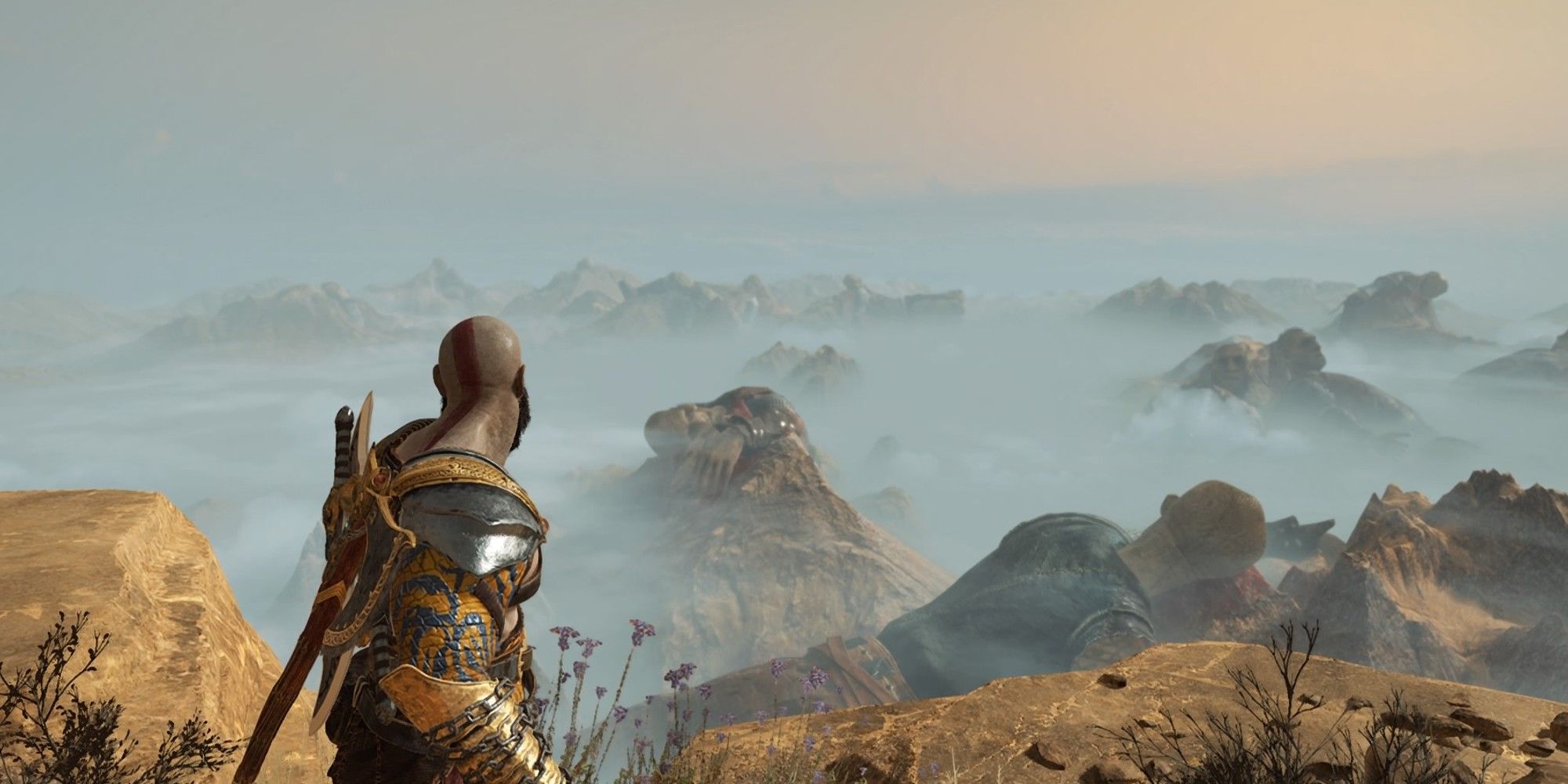 Kratos overlooking the valley of the dead, which his full of dead giants, in Jotunheim