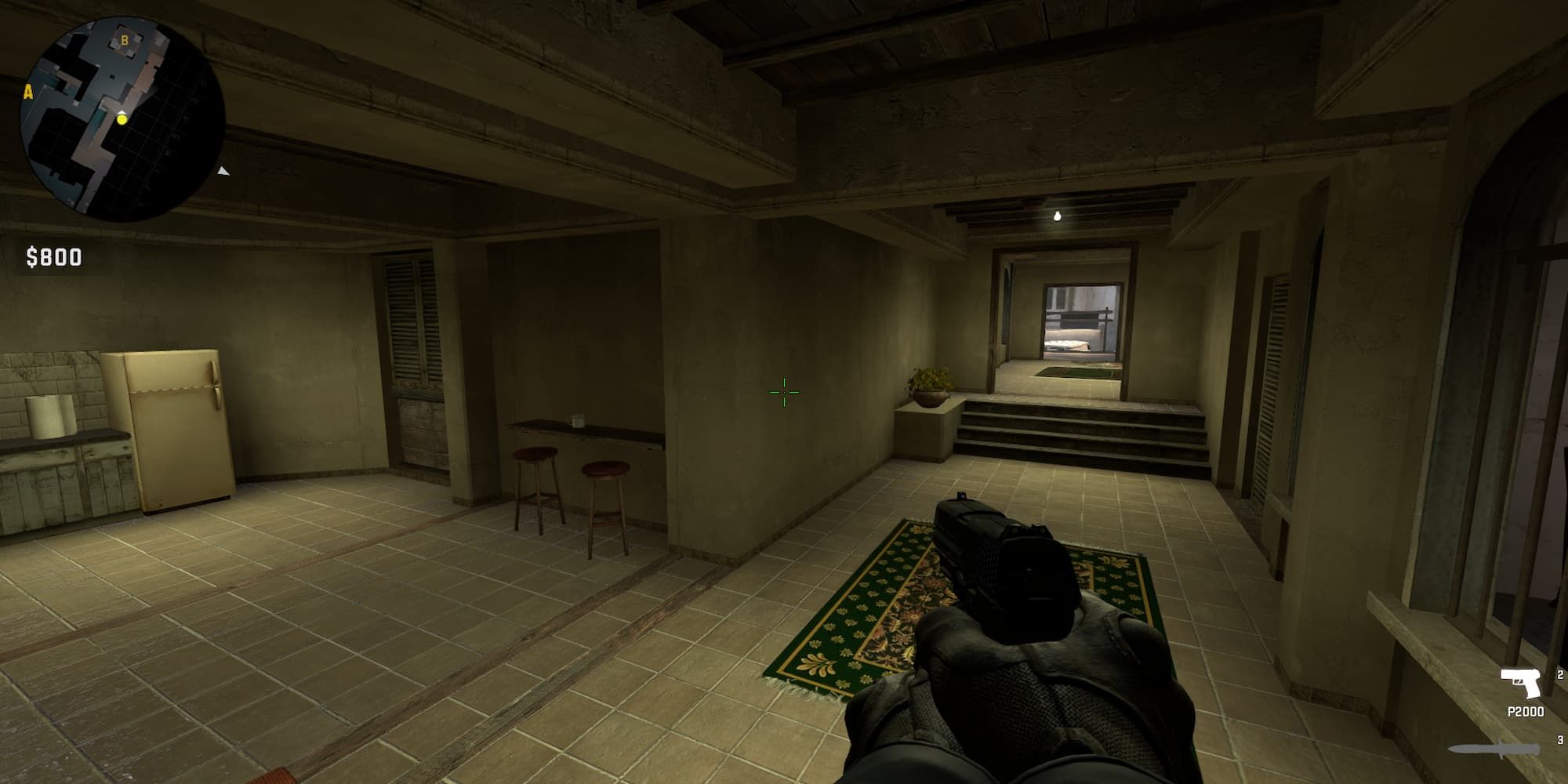 In the corner of Apartments on Mirage, a player camps on top of a table.