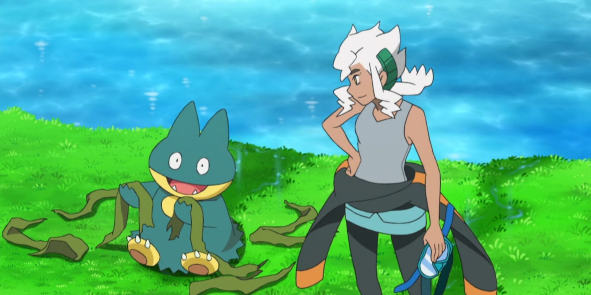 Munchlax plays with some seaweed beside Professor Burnet