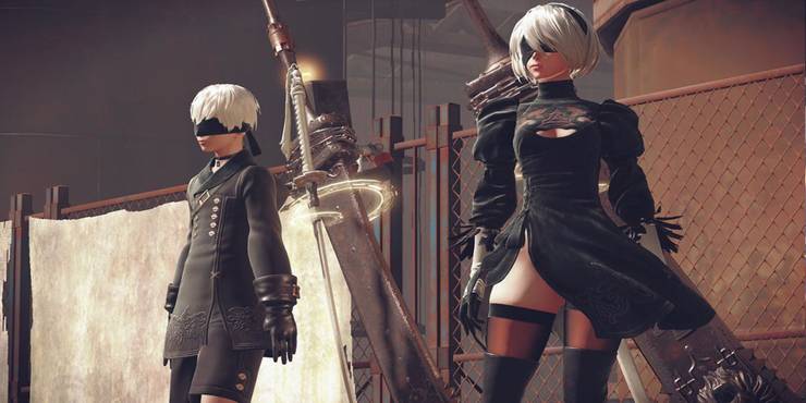 2B and 9S standing next to each other and looking into the distance