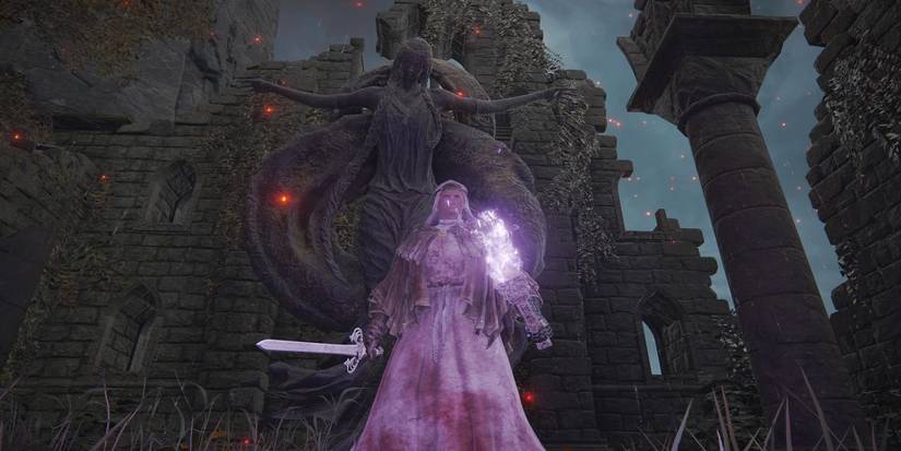 The tarnished holding the Sword of St. Trina, standing before a statue of Marika in Elden Ring.