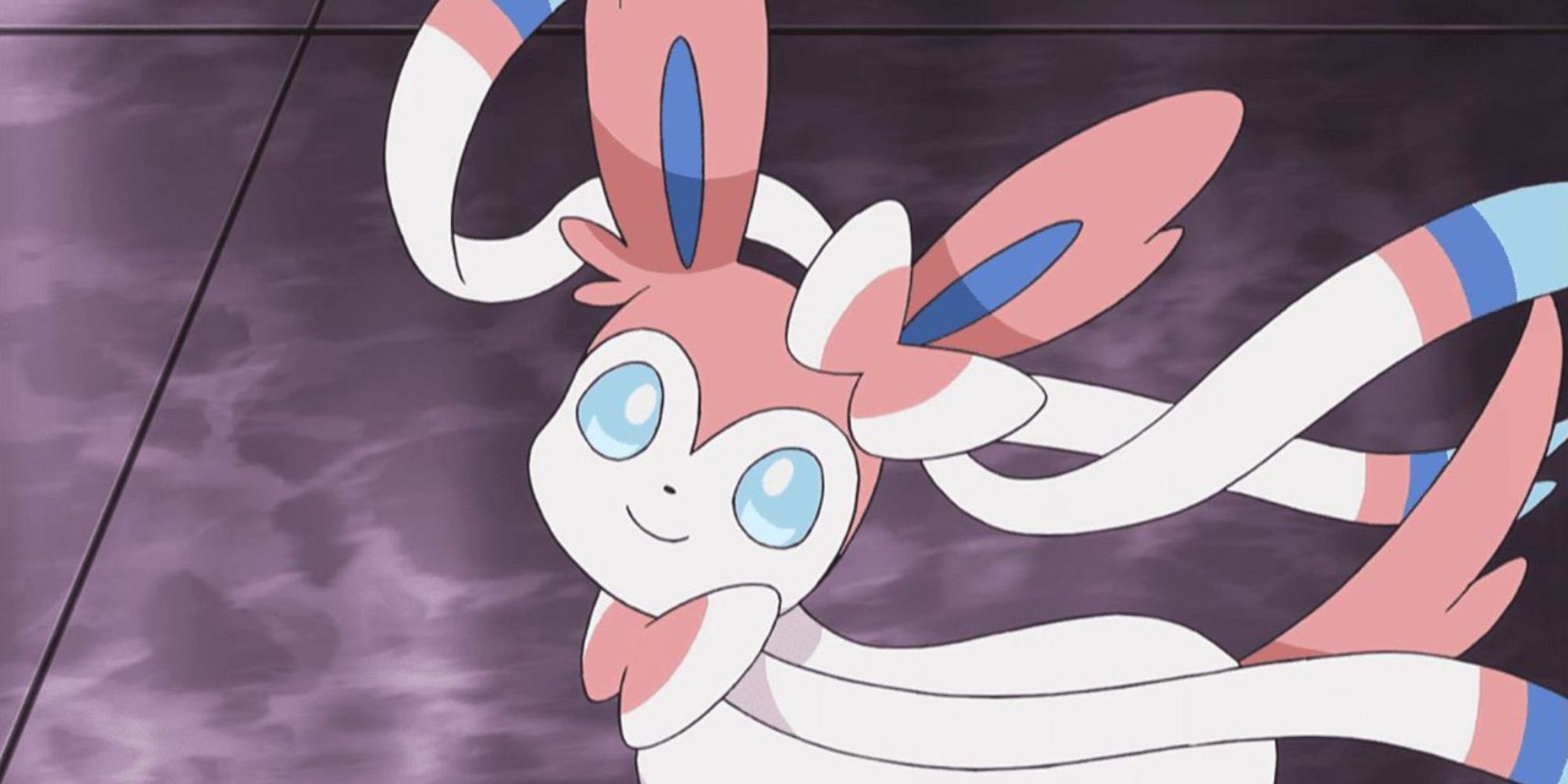 Sylveon looks up with a smile on its face
