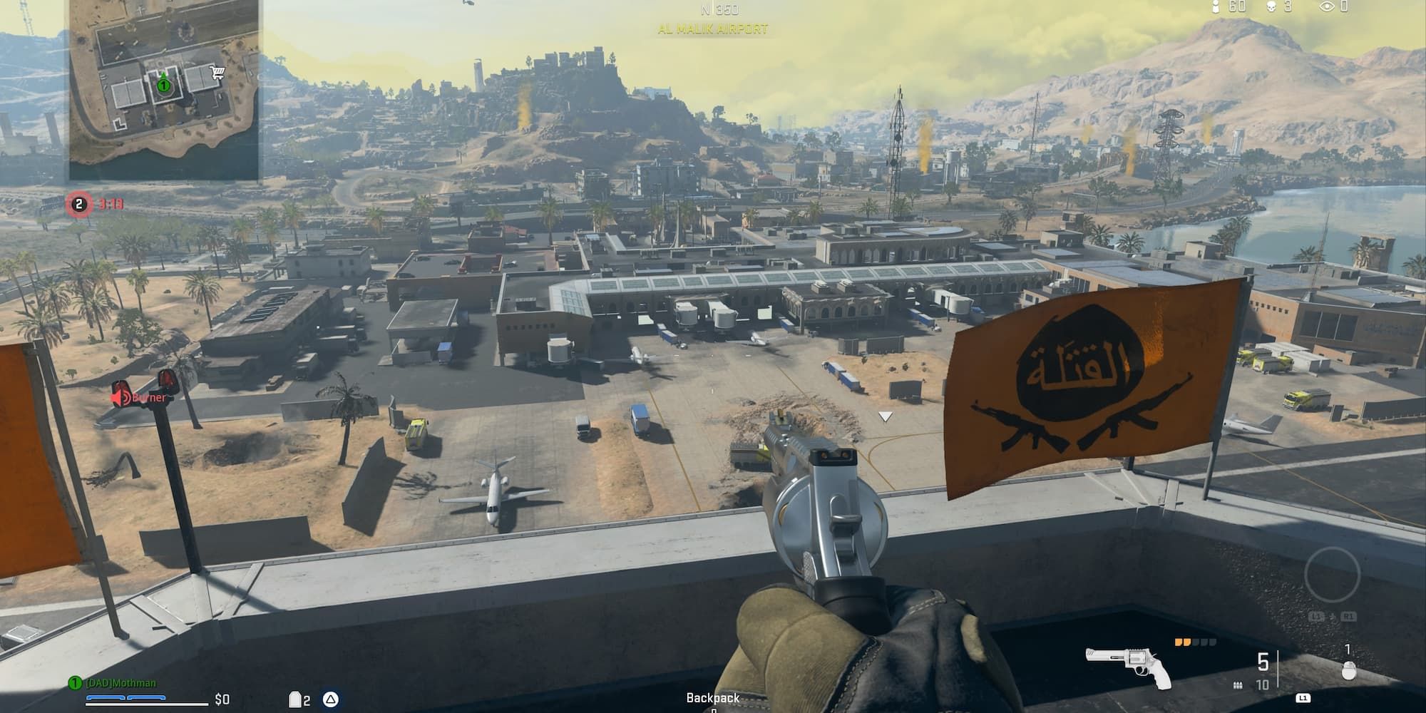 A player and his revolver look down at the Al Malik Airport from the top of the air traffic control tower.