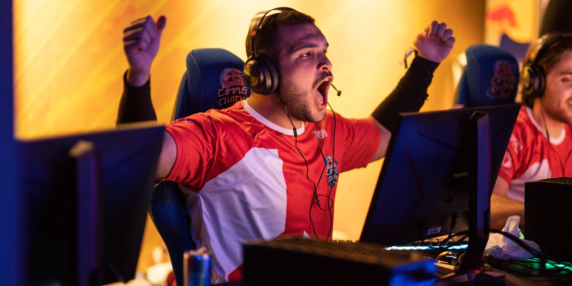 another valorant red bull campus clutch player happy and shouting with their arms raised-1