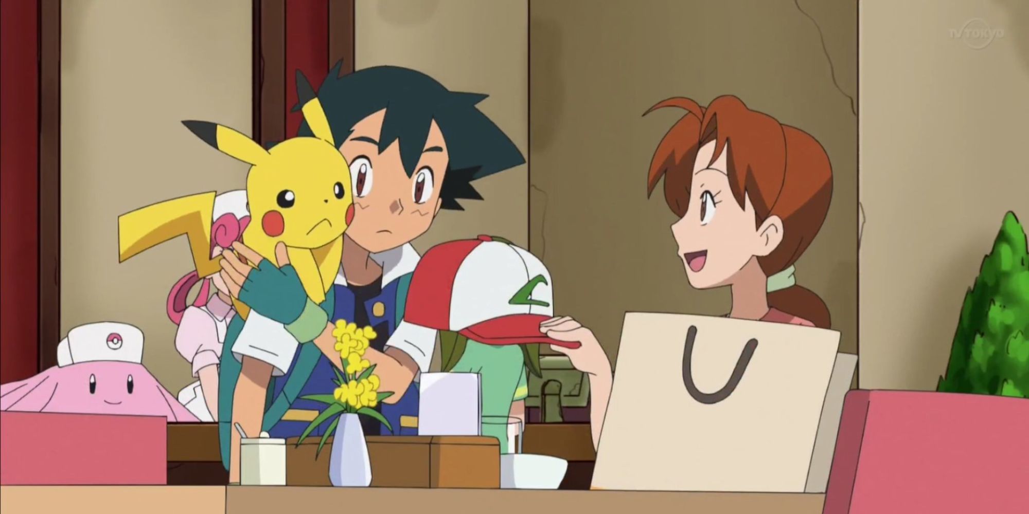 Ash being given a gift from his dad in the Pokemon anime.