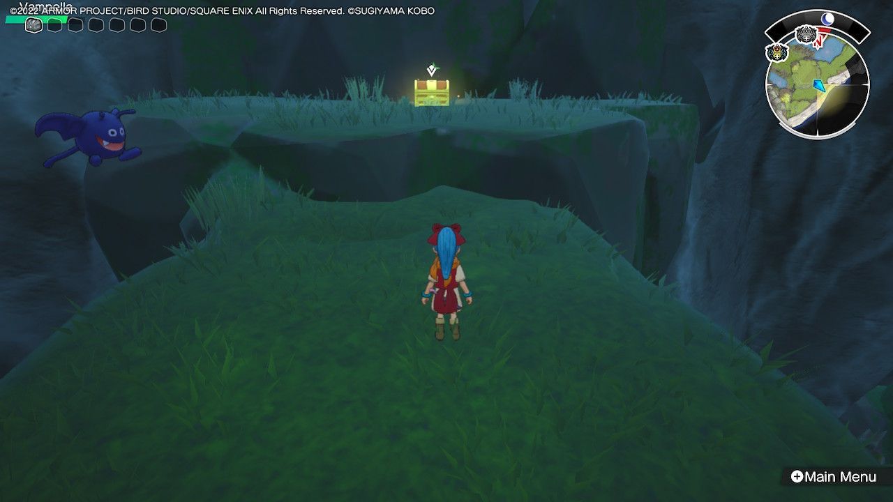 A red chest hidden on top of a cliff above a waterfall in Dragon Quest Treasures.