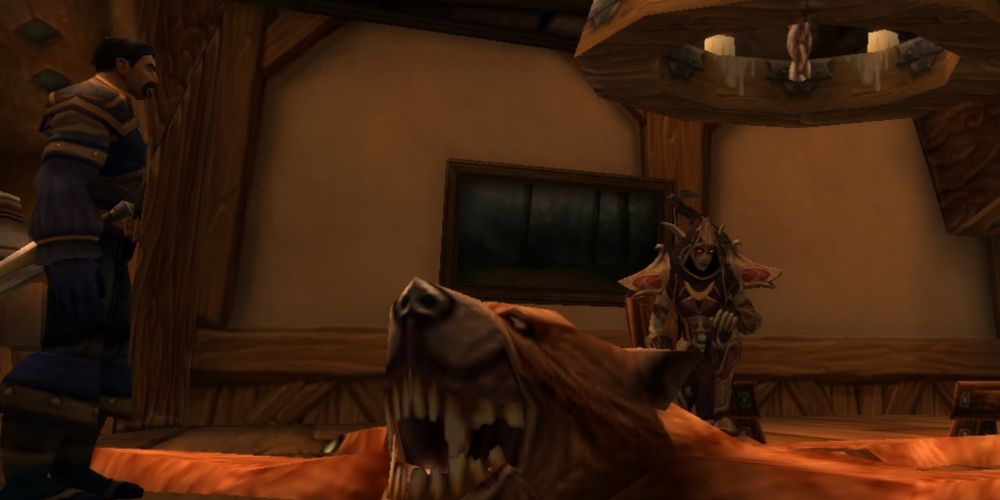 World of Warcraft: Dragonflight - Marksman Hunter Kneeling over her Kill