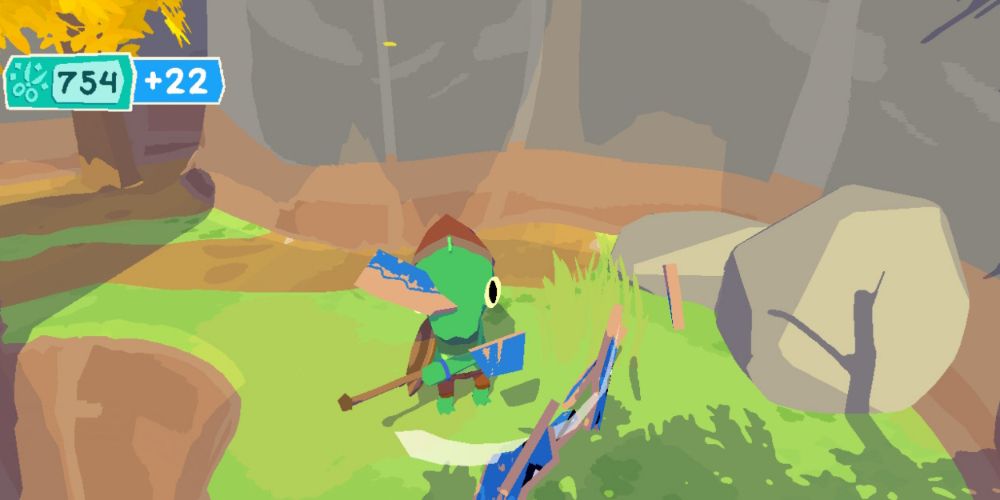 The protagnoist uses their sword to destroy a cardboard enemy in Lil Gator Game.