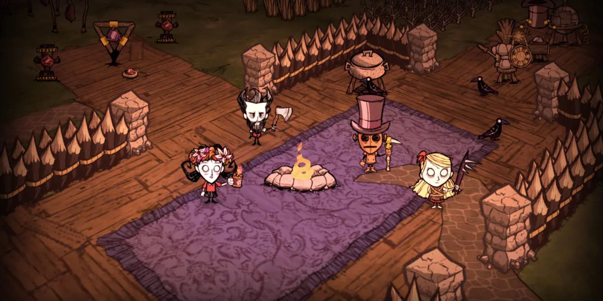 Four players holding different weapons and standing around a bonfire